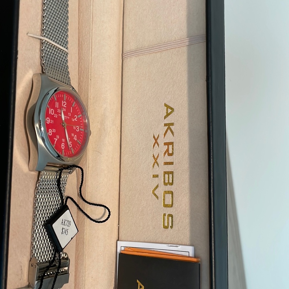 Men’s Akribos XXIV watch with red face NWT.